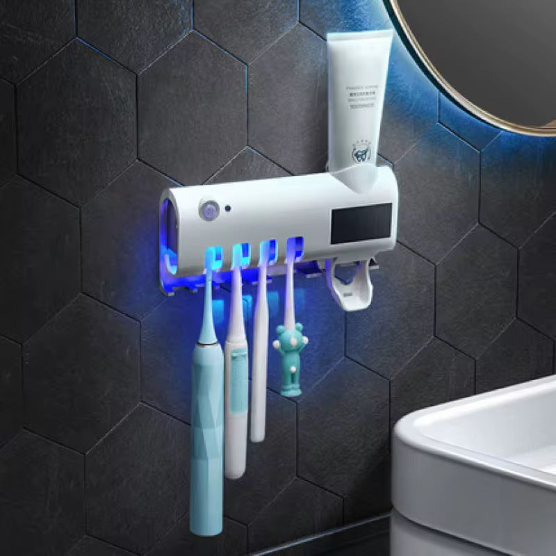 Toothbrush UV sterilizer and toothpaste squeezer